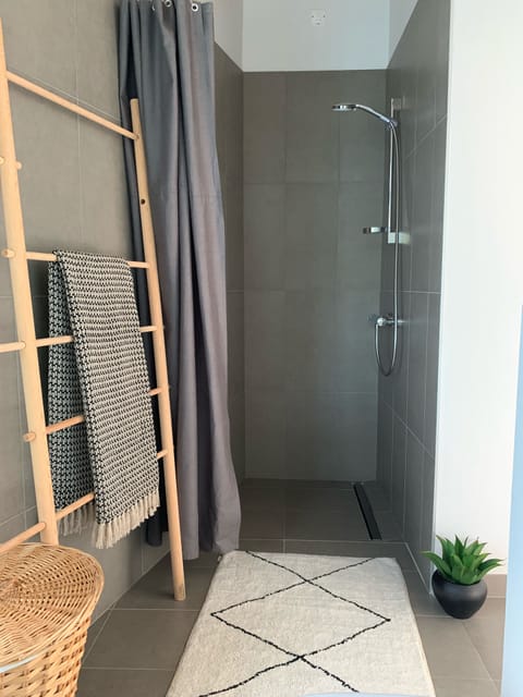 Combined shower/tub, hair dryer, towels, toilet paper