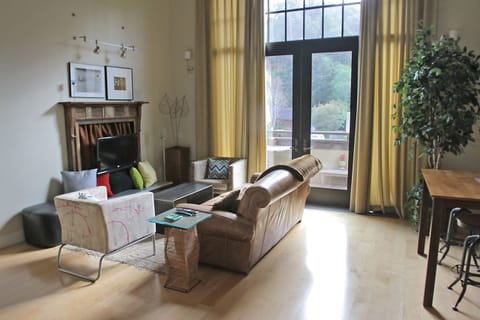 The living area, 30 foot ceilings. Dinning table can be used for four persons