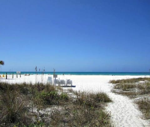 On the beach, sun loungers, beach towels