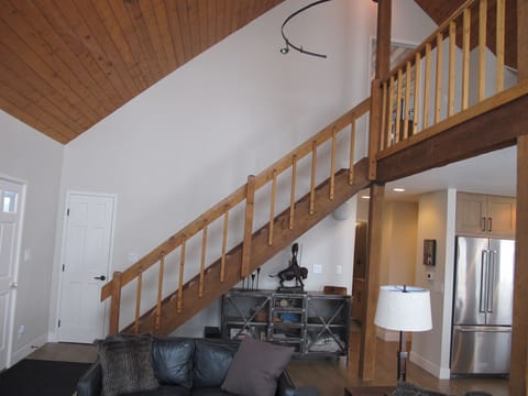 staircase up to loft and master suite, tongue and groove vaulted ceiling