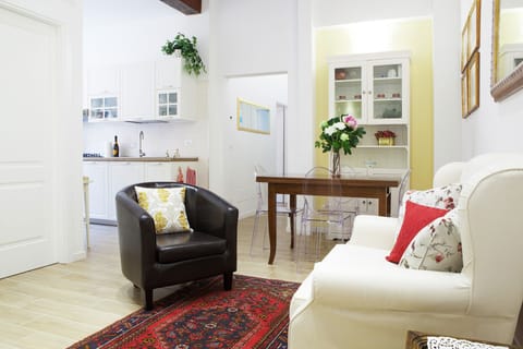 The living-area-a detail-with kitchen and corridor. Wooden beams .