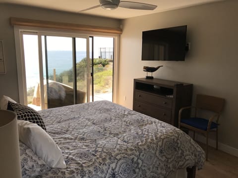 TV in master bedroom; unobstructed ocean views from private corner unit.