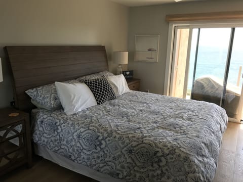 Allow the ocean waves to put you to sleep in this beautiful master bedroom.