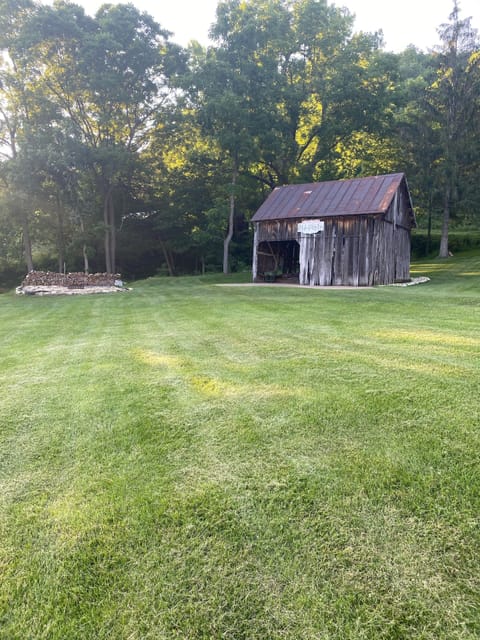 Fire pit and hay barn view.