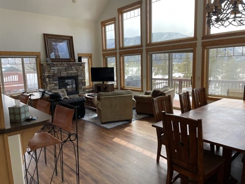 Dining room with seating for 8-12 with lake and mountain views. 
