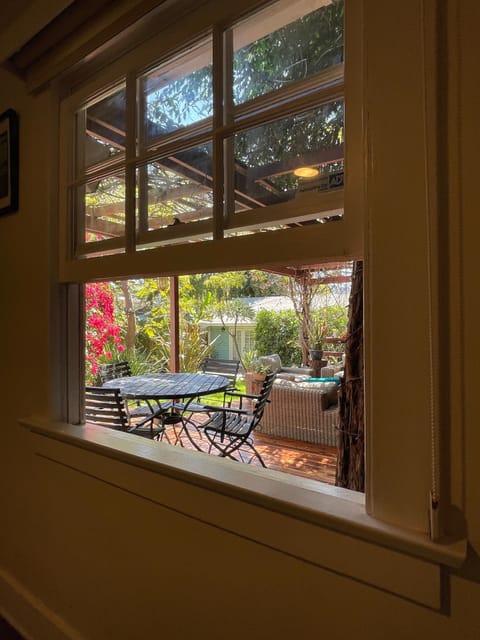 bedroom 1 - queen bed - colorful view of garden