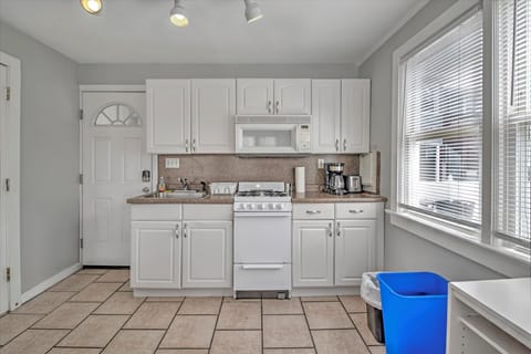 Fully equipped kitchen includes a traditional drip coffee pot and toaster