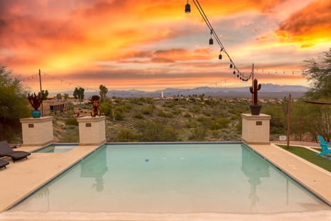 Breathtaking views of the Emerald Wash & Four Peaks from this tranquil backyard.