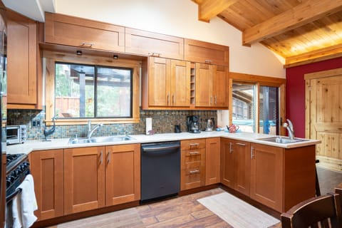 This recently remodeled kitchen is not only visually stunning but also fully equipped with everything you might need to prepare a home-cooked meal