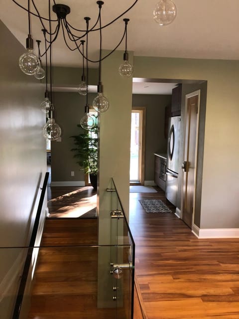 Entryway looking towards kitchen and lower level staircase