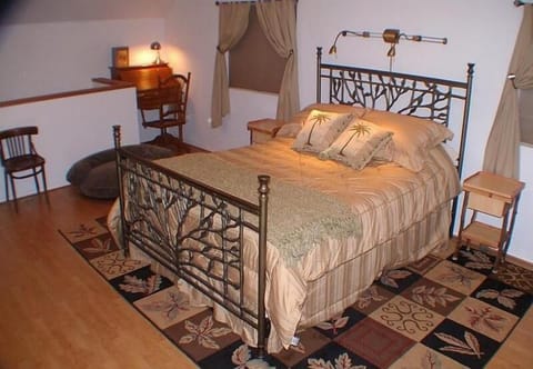 The entire upstairs is one large room with a queen bed
