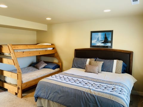 ground level bedroom king bed, twin over full bunk beds