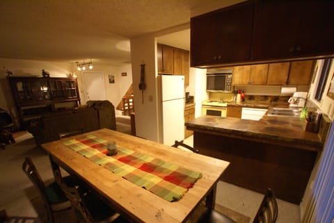 Main level dining room opens to both kitchen and family room.