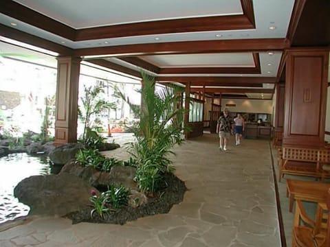 Lobby area is open and beautiul with koi ponds.