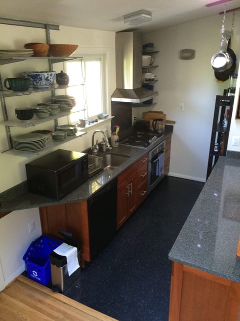 Microwave, dishwasher, coffee/tea maker, cookware/dishes/utensils