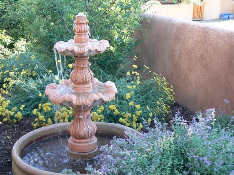 The trickling water in the fountain is so relaxing while out in the lush yard.