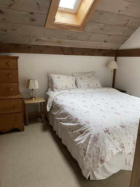 Main level bedroom with queen bed. 