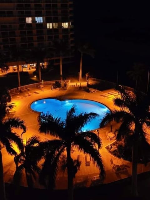 View of the pool at night from the balcony.