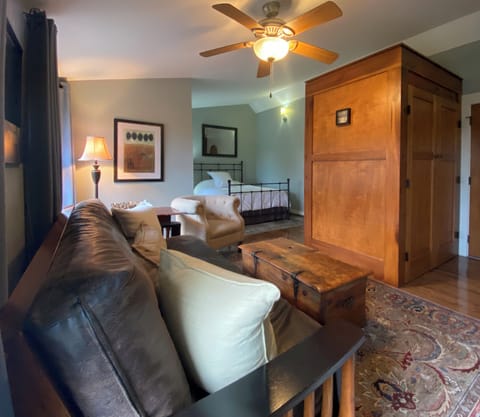 closet divides the space, kitchen to the right