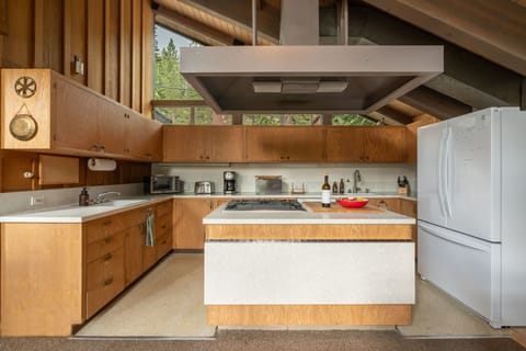 Kitchen with large island and fold-up bar.