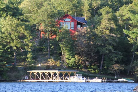View of the house from the lake. Association dock with sun deck 