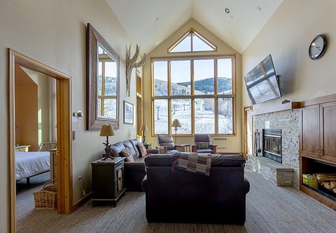 Great room with queen sleeper sofa. Overlooks slope.