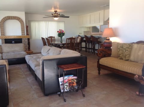 Living room and dining area in background