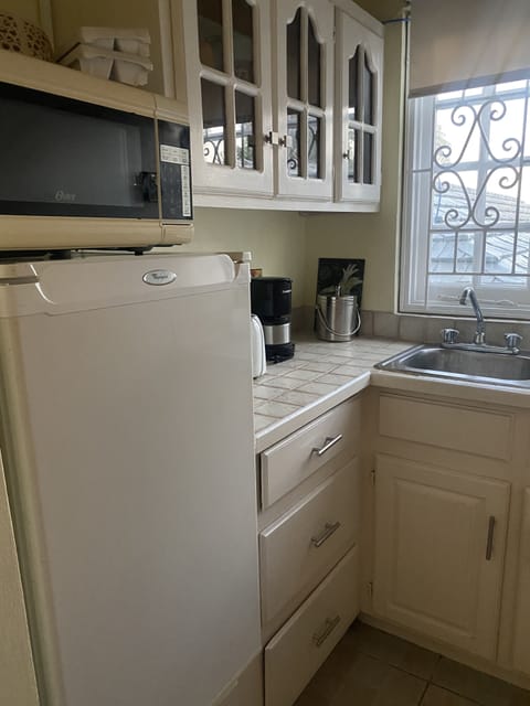 Fridge, microwave, stovetop, coffee/tea maker