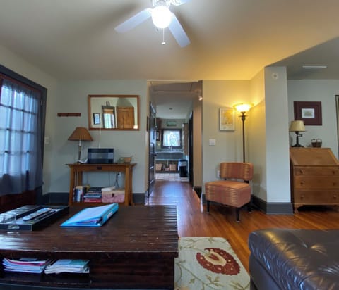 Sitting area looking toward Kitchen, front door and deck on left