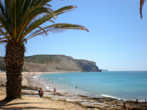 On the beach, sun loungers, beach towels