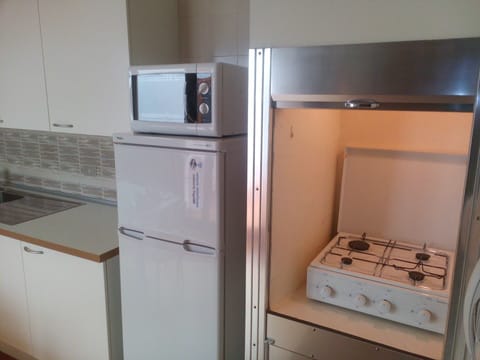 Fridge, stovetop, coffee/tea maker, cookware/dishes/utensils