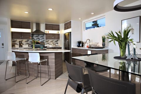 Kitchen Area with Island Bar for entertaining guests in Living and Dining Areas 
