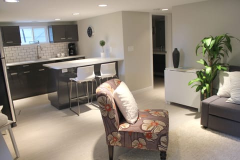 View from the front entry, through to living room, kitchen and bath.