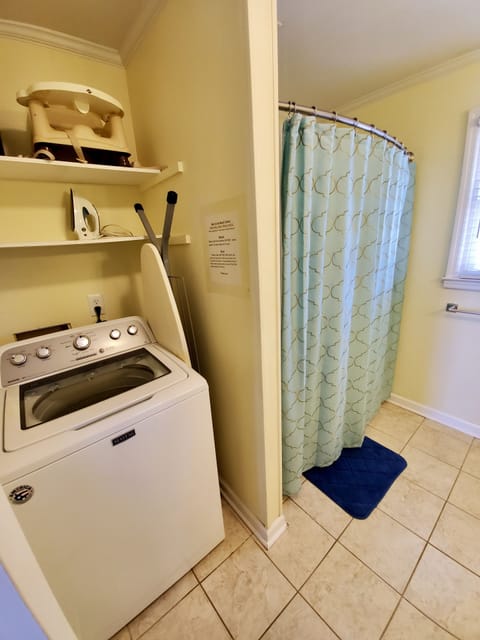 Hall bathroom main level has Maytag washer and dryer