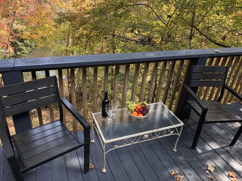 Deck overlooking the river (hard to see since the water blends into the leaves.