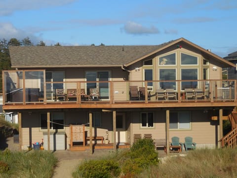 Beach side of house, patio and deck.
