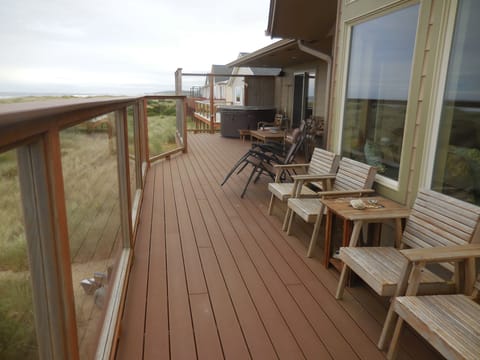 Beachside deck with lots of seating and an ocean view.