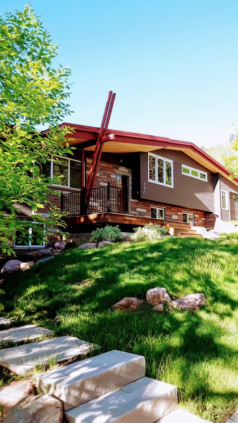 Modern home with natural prairie grass landscape. Premier Boulder location.