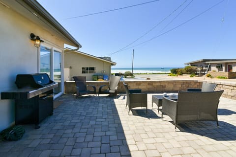 Enjoy sitting on this beautiful front patio listening to the surf