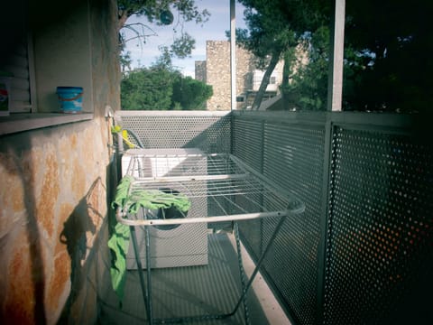 washing machine and drying rack on second balcony