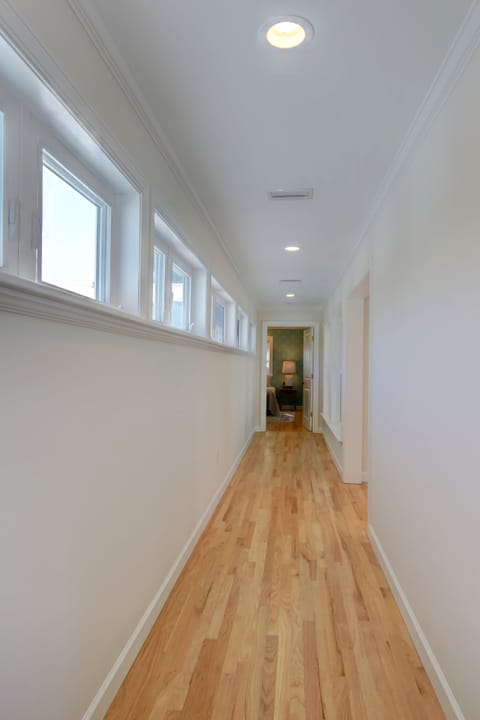 long hallway separates two upstairs bedrooms