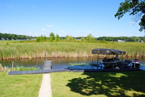 Your dock (left) in the backyard. Large enough for boats up to about 25 feet.