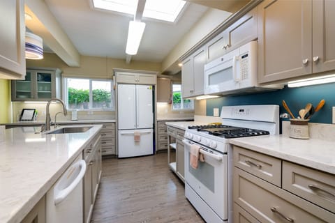 The kitchen has been fully remodeled with new cabinets and appliances