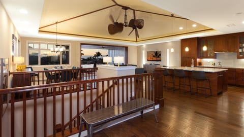 Large open concept floor plan with vaulted grass cloth ceilings