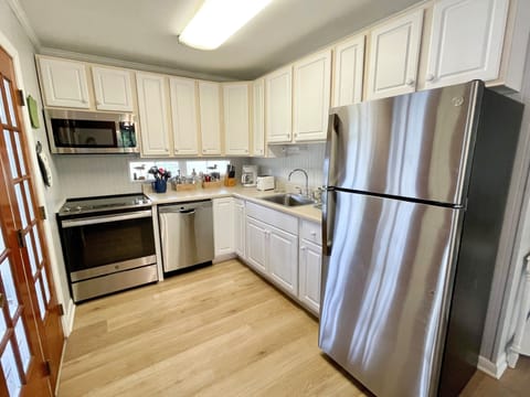 Fridge, microwave, dishwasher, dining tables