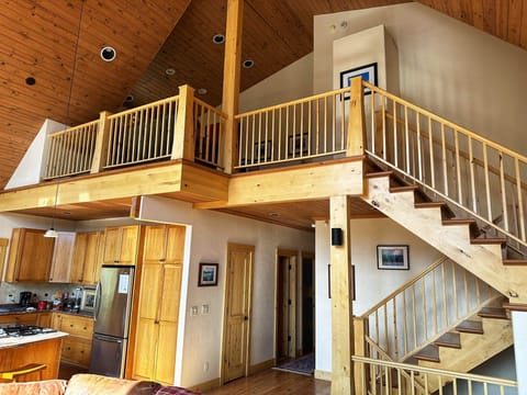 Upper loft overlooks the main area of the home.