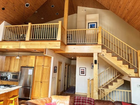 Stairways up to the top floor and down to the lower level.