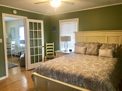 Queen bed with tempurpedic mattress topper and adjoining full bathroom & fan!