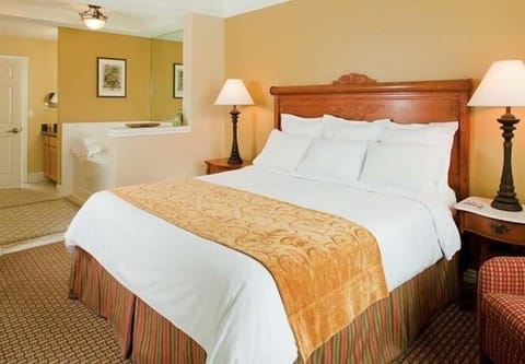 Relax on a king-size bed with plush bedding 
for a peaceful night's sleep.
