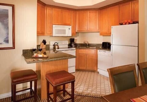 A fully equipped kitchen and separate dining area offer the comfort you need.